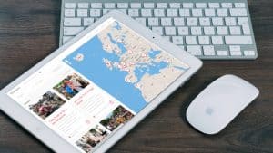 Fleamapket flea market directory displayed on iPad and laptop side by side