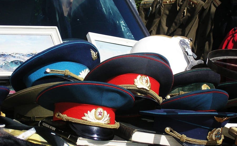 Soviet military caps and Red Army uniform parts on sale at the Latgale Tirgus in Riga