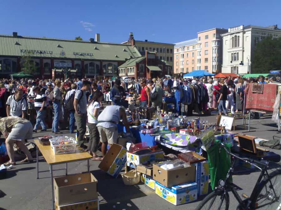 Hakaniemi square Helsinki Sunday flea market outdoor stalls and buyers