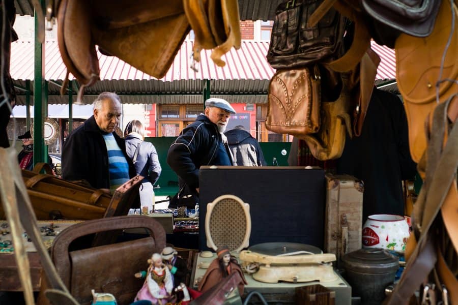 Vendors selling vintage items and collectibles at the Saturday market on Plac Nowy in Krakow