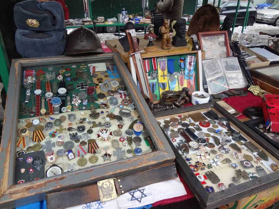 Shoppers browsing antiques and second-hand goods at the Plac Nowy Saturday market in Kazimierz