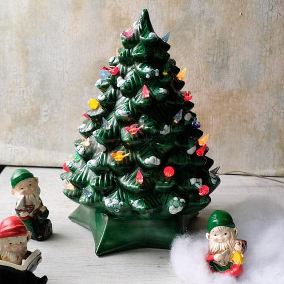 White ceramic tabletop Christmas tree with multicoloured pegs and star topper