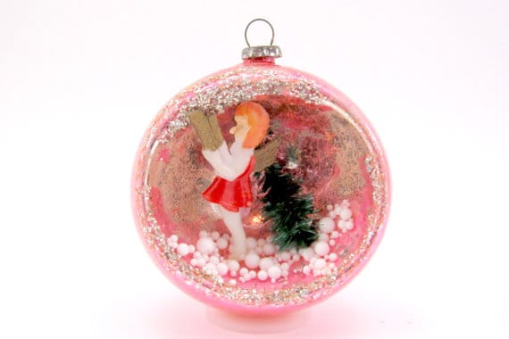 Hollowed glass diorama Christmas bauble containing a miniature snowy nativity scene