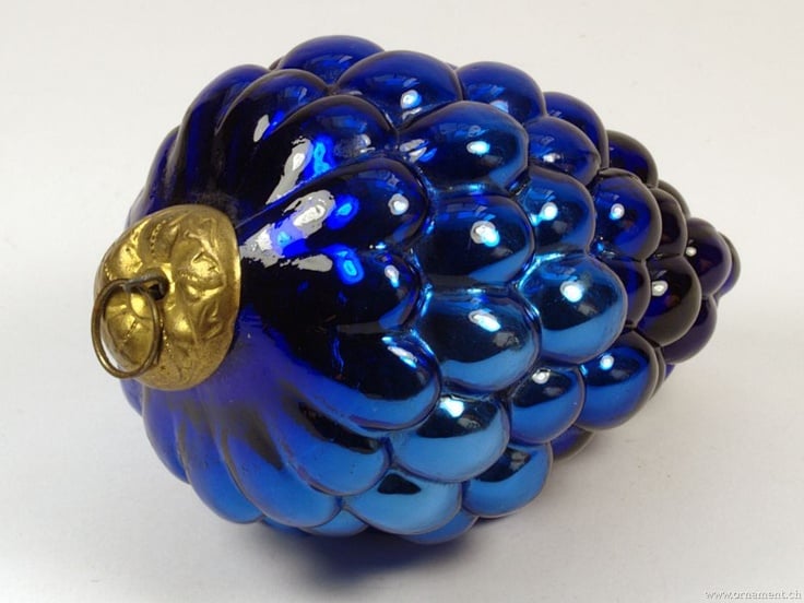Close-up of a vintage German Kugel glass bauble in deep red
