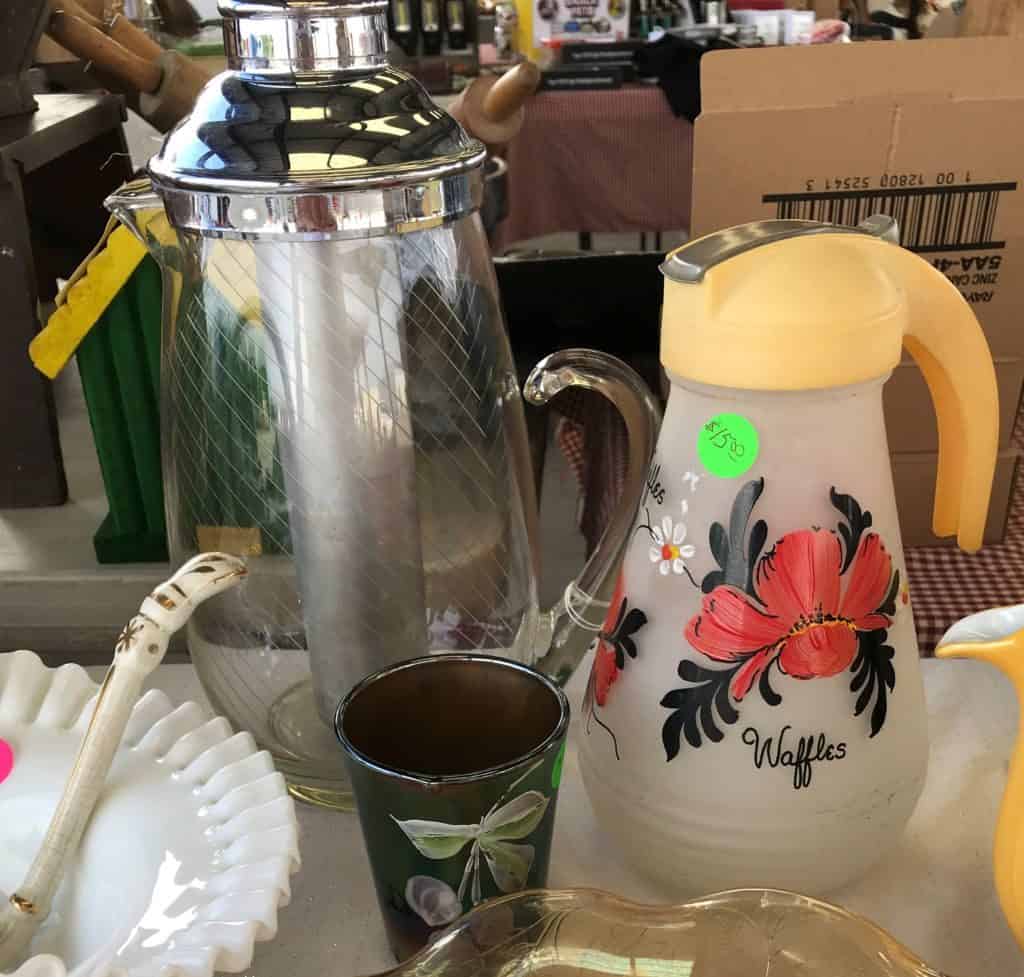 Vintage glassware including Gilley water pitcher at Caesar Creek Flea Market Ohio