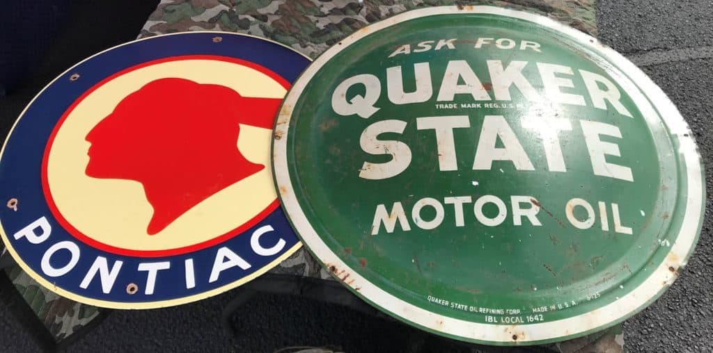 Petroliana and vintage advertising signs in the parking area at Caesar Creek Flea Market Ohio