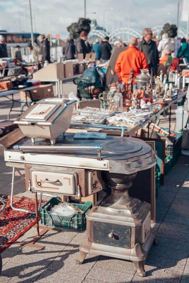 Jewelry and antique objects on display at the Spīķeri Flea Market in Riga Latvia